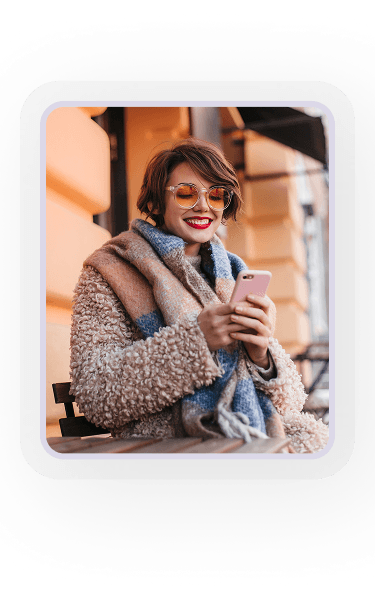 Woman enjoying coffee while using phone